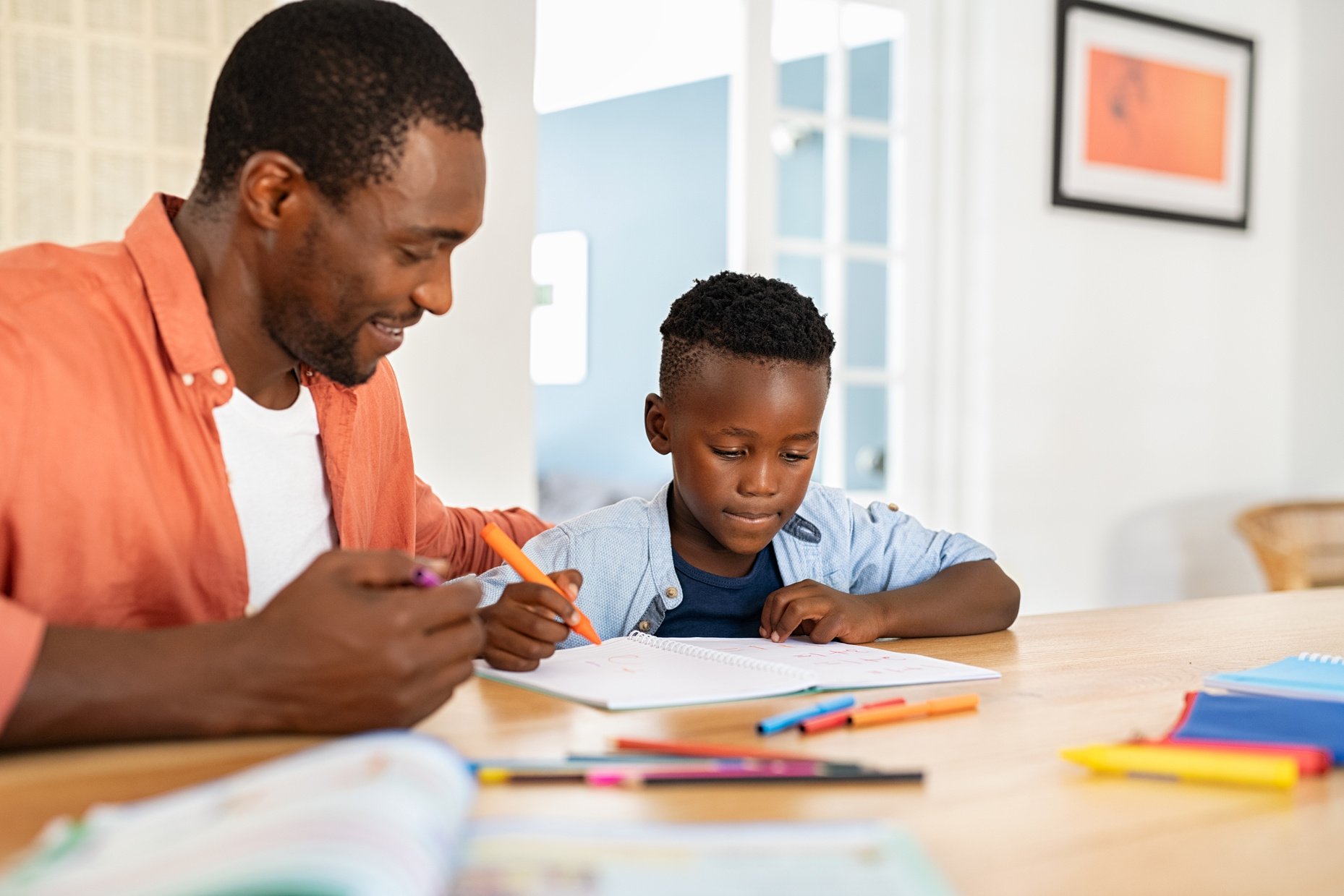 Father Helping Son with Homework